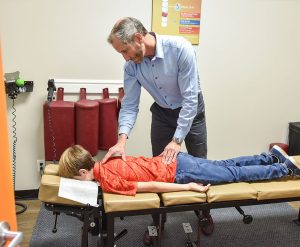 Dr Don Findlay With Patient | Chiropractical | SW Calgary | Chiropractor